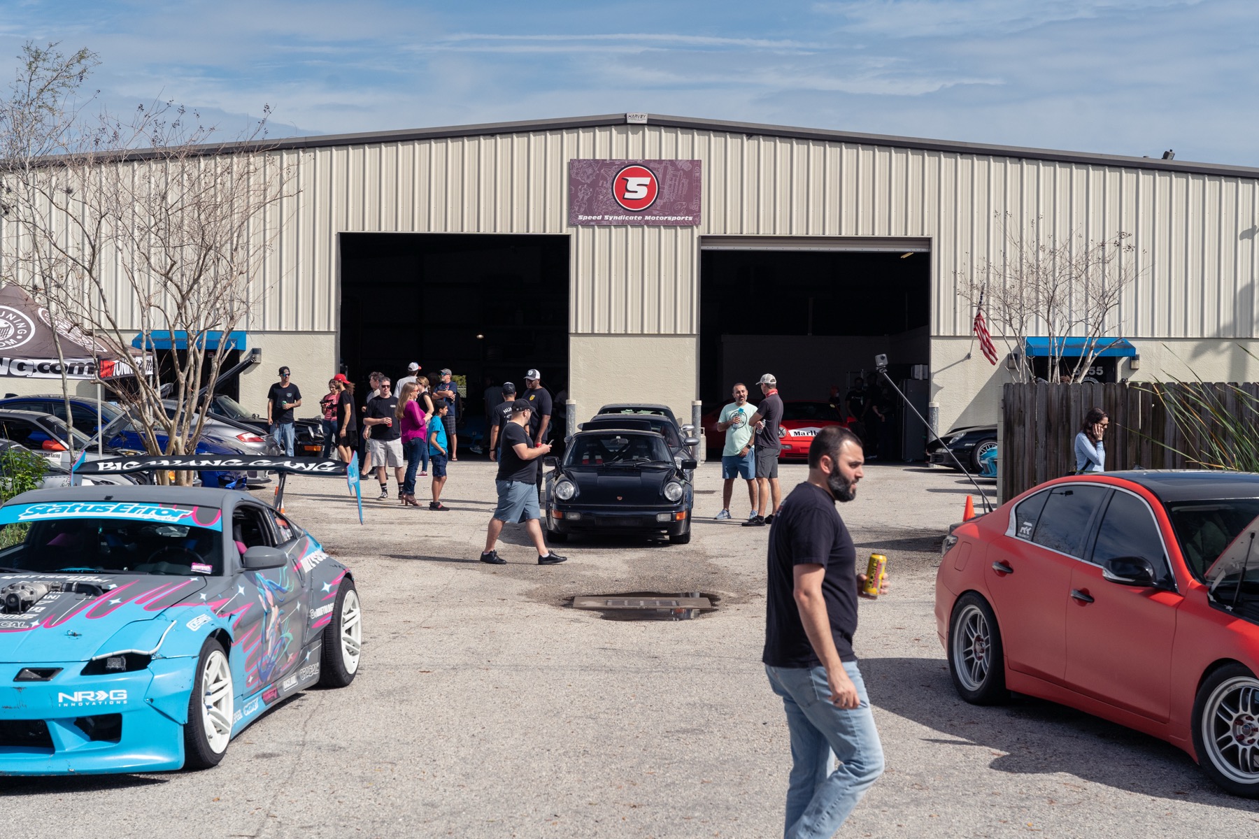 Customer car with the hood up during in-house tuning and diagnostics at the Speed Syndicate shop